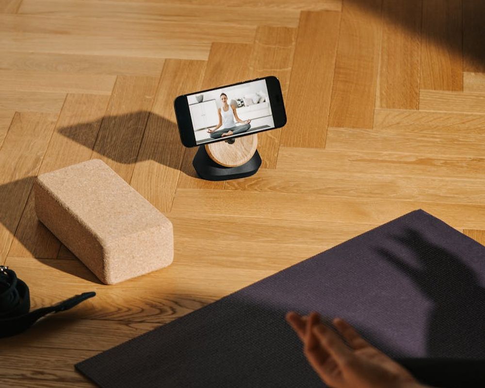 Detailed close-up of a yoga mat and weights on a dark floor